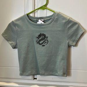 blue cropped t shirt with small snake design